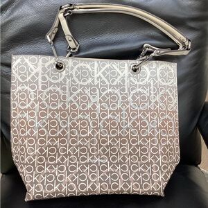 CK bag, used 1 time.Like new. Base of bag= 12 1/2”. Height= 13”. Handle drop=10”